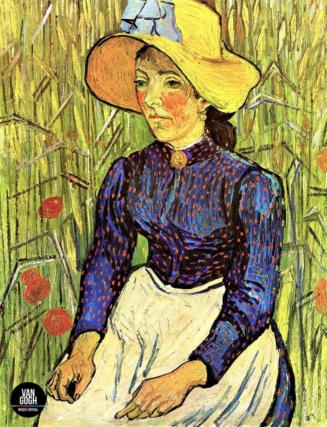 joven campesina con sombrero de paja sentada delante de un trigal