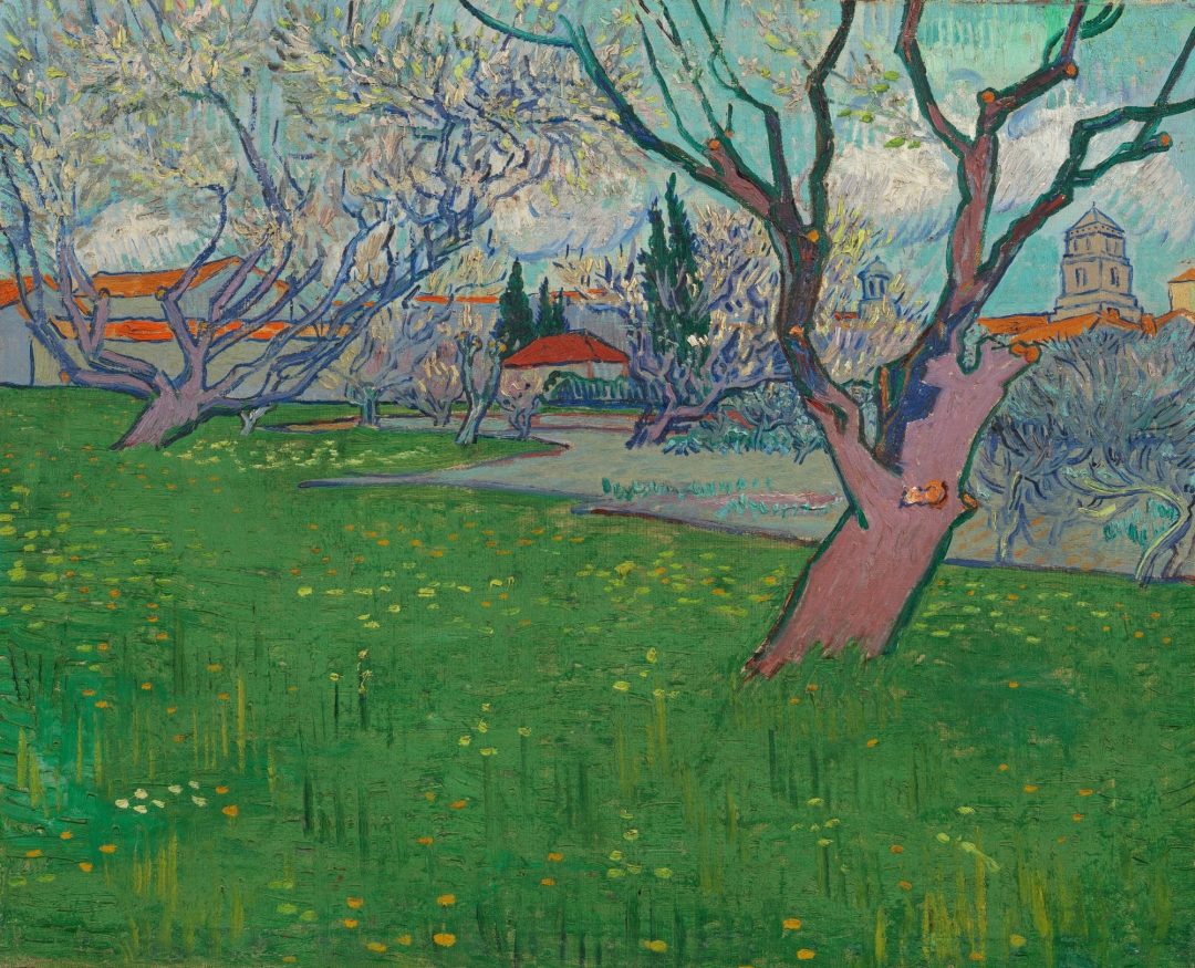 Huertos en flor, vista de Arlés, de Van Gogh (1889): árboles en flor y tejados de Arlés